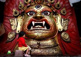 Bhairav. note the fierce expression and sharp teeth. This particular image is famous and locate din Kathmandu, where it is only displayed during the festival of Indra Jatra.