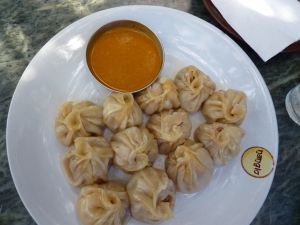 Momo. with a small dish of achaar. the filling is usually meat. steamed. widely available.